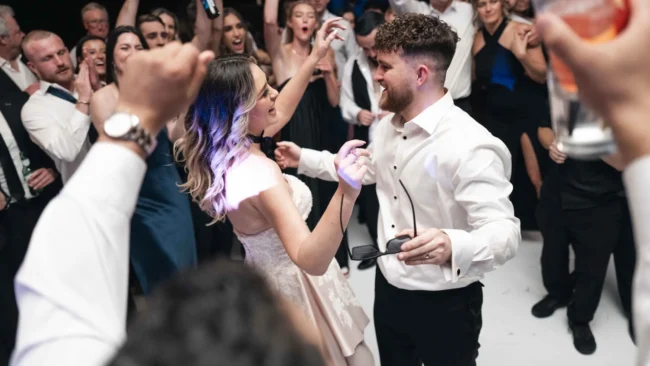dani-and-trevor-wedding-candid-moment-of-bride-and-groom-at-reception-photo-phoenix-arizona